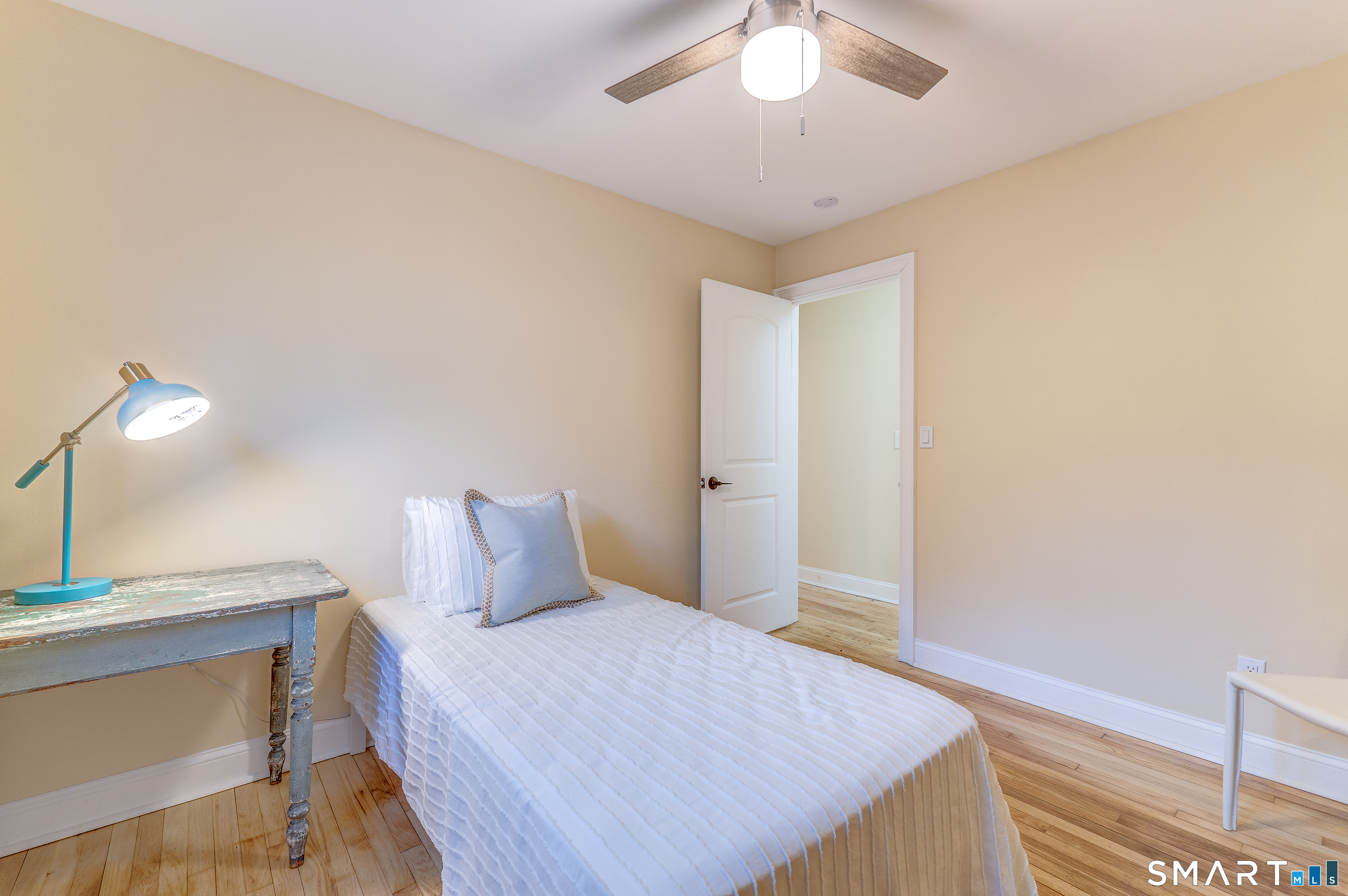 24 Evergreen Road North Branford, CT 06472 - Photo 18 of 24 a bedroom with a bed and a chandelier