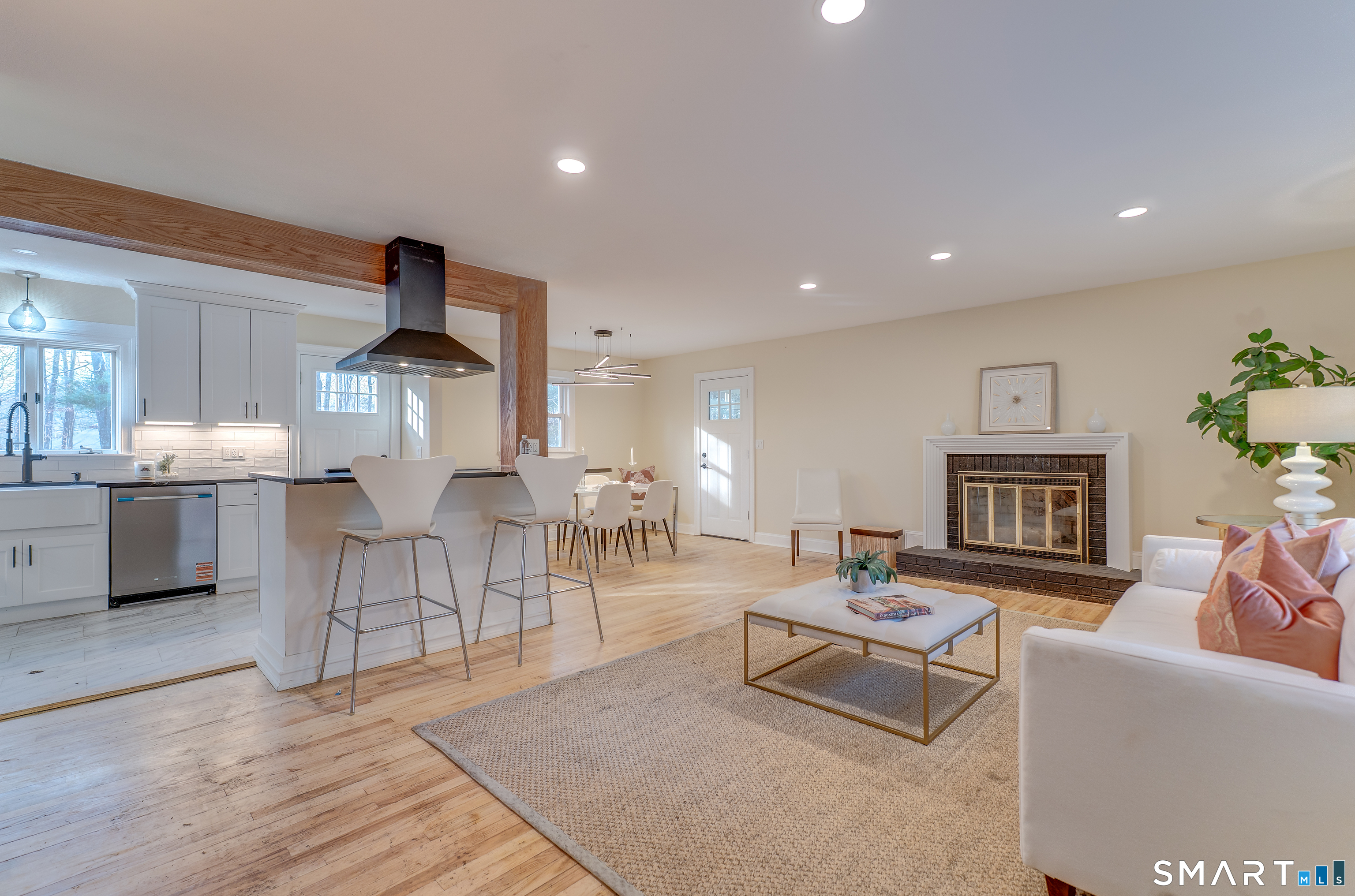 24 Evergreen Road North Branford, CT 06472 - Photo 6 of 24 a living room with furniture a wooden floor and a fireplace