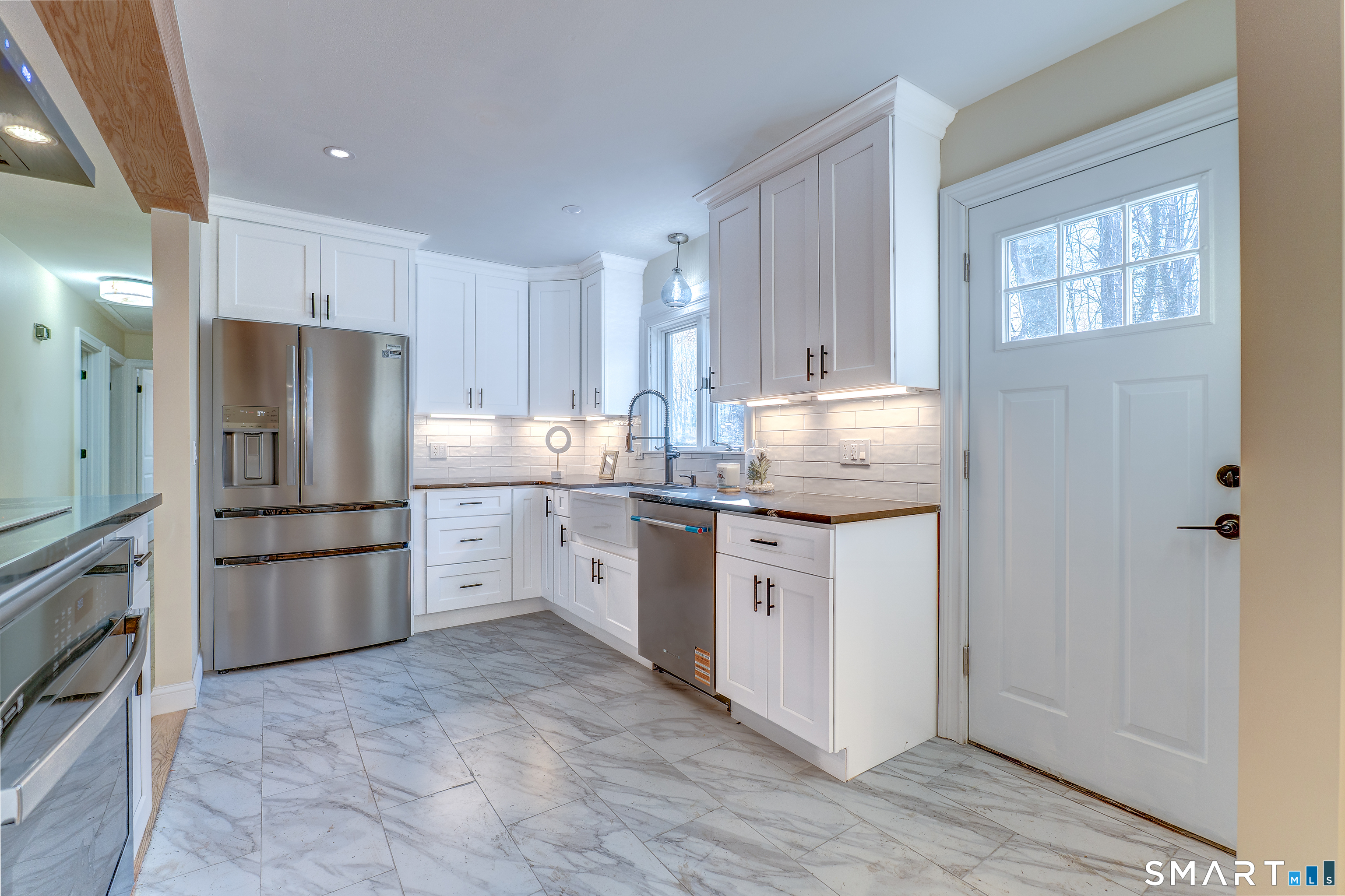 24 Evergreen Road North Branford, CT 06472 - Photo 9 of 24 a kitchen with a refrigerator sink and cabinets