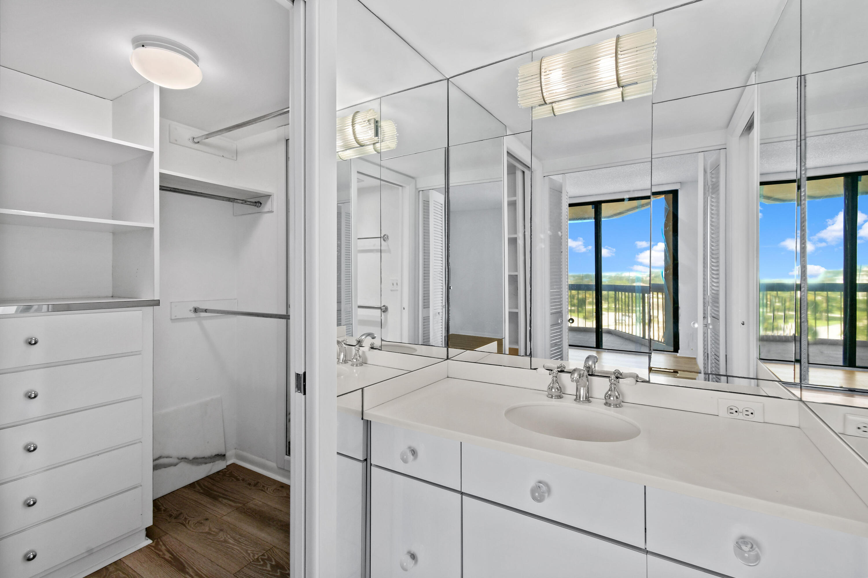 2425 Presidential Way, Unit 801 West Palm Beach, FL 33401 - Photo 14 of 41 a bathroom with a sink and a mirror