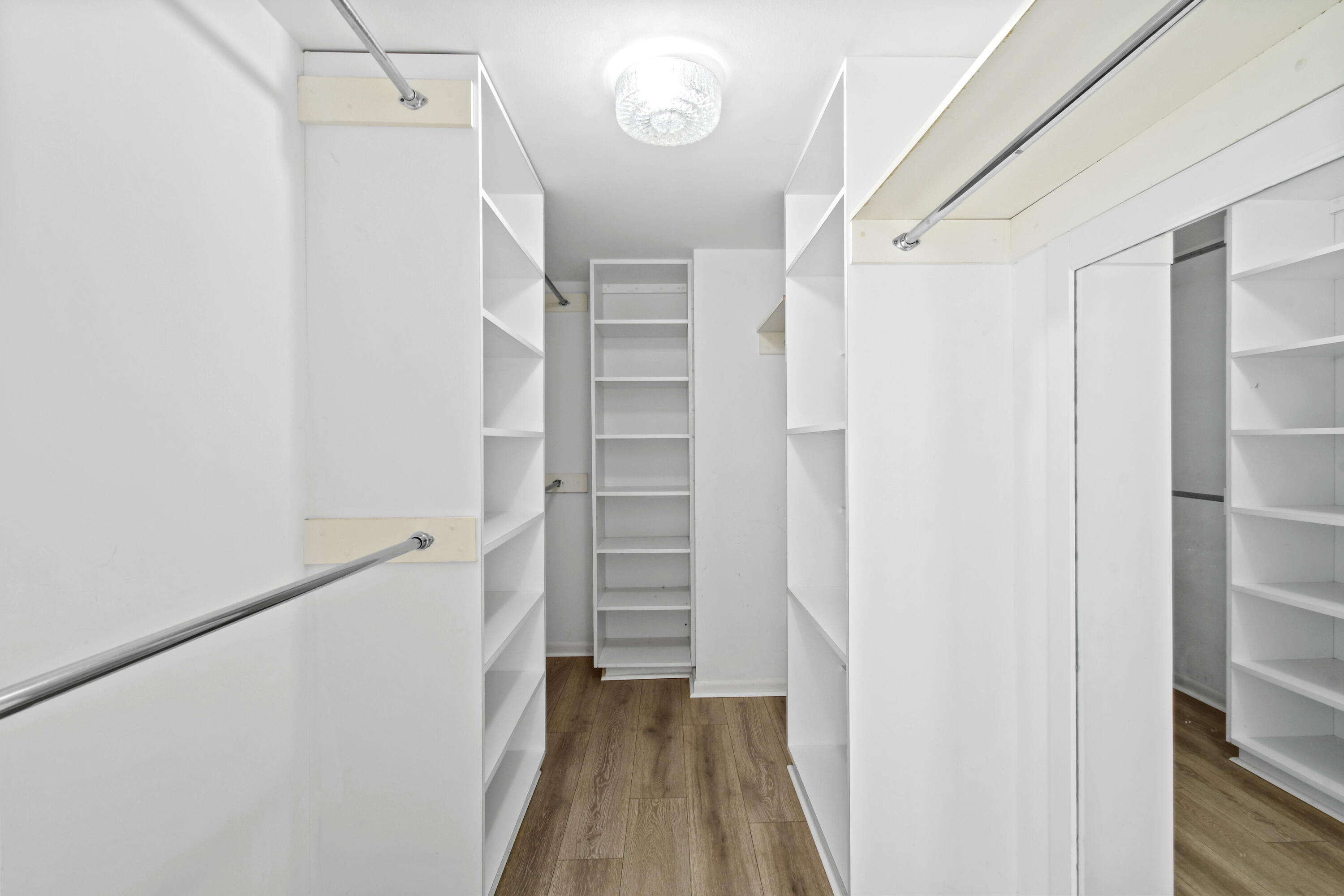 2425 Presidential Way, Unit 801 West Palm Beach, FL 33401 - Photo 30 of 41 a view of walk in closet with empty racks