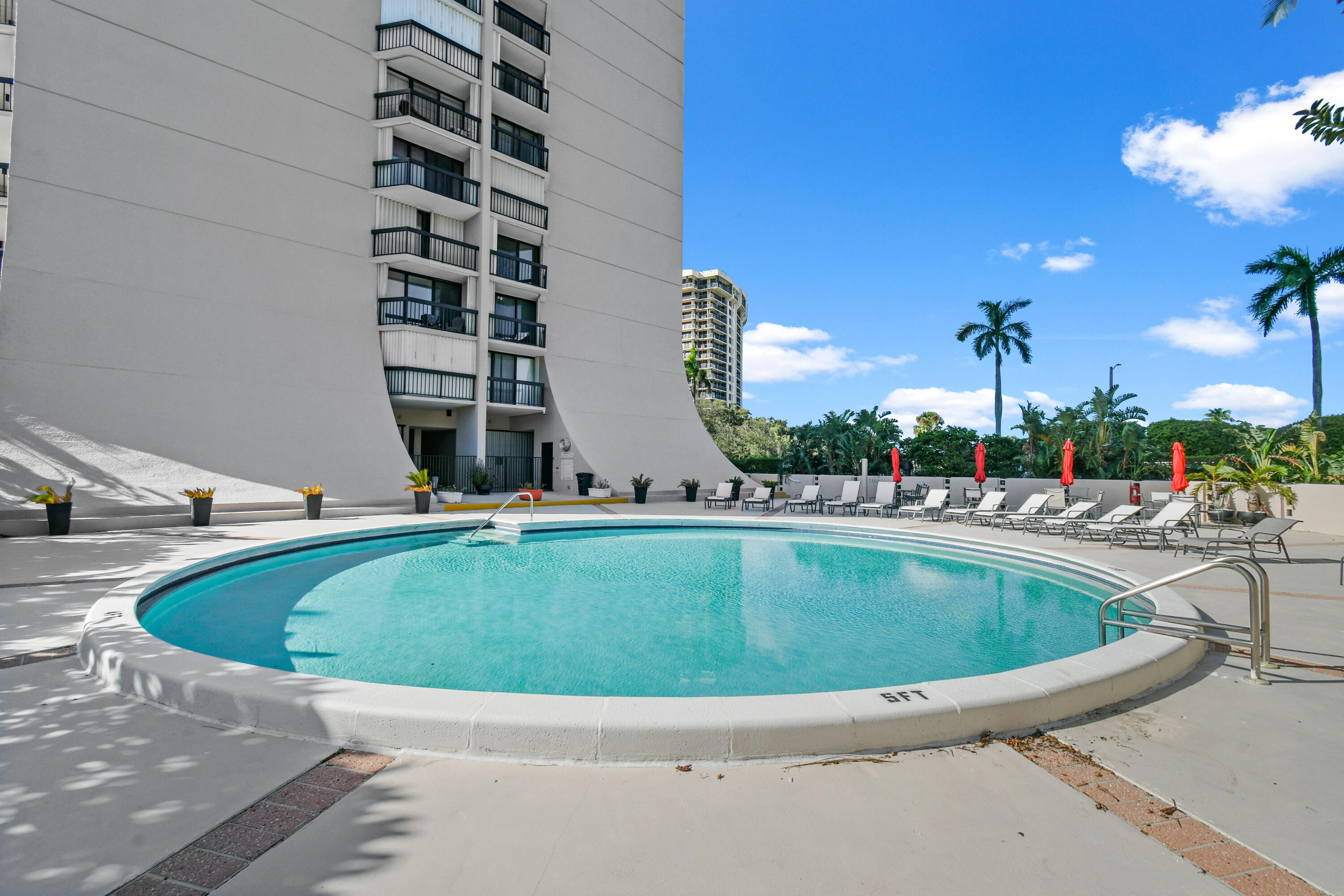 2425 Presidential Way, Unit 801 West Palm Beach, FL 33401 - Photo 37 of 41 a view of swimming pool with outdoor seating and city view