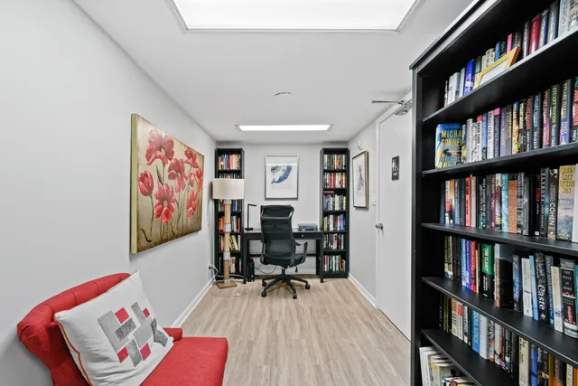 a workspace with furniture and book shelf
