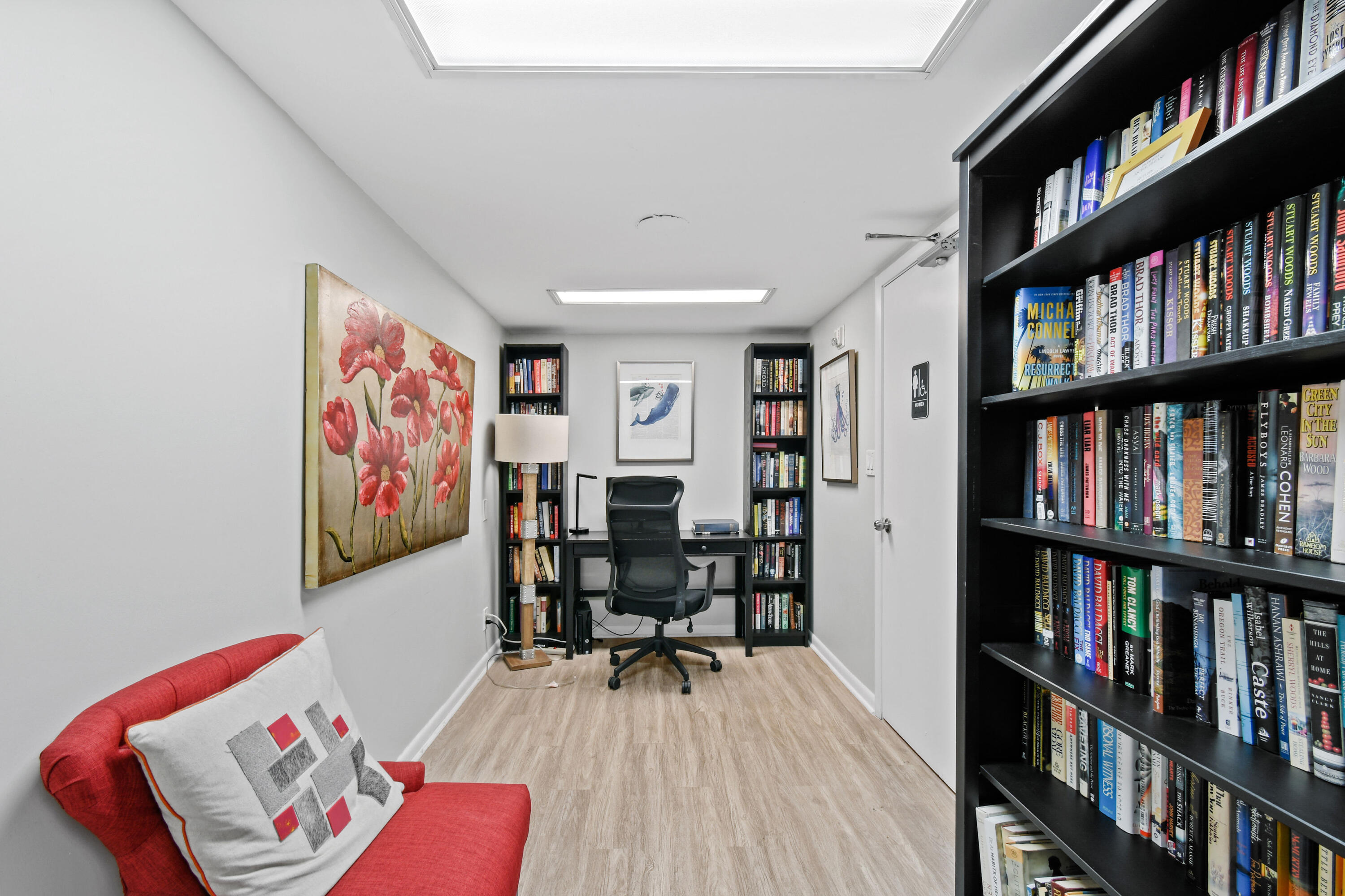 2425 Presidential Way, Unit 801 West Palm Beach, FL 33401 - Photo 39 of 41 a workspace with furniture and book shelf