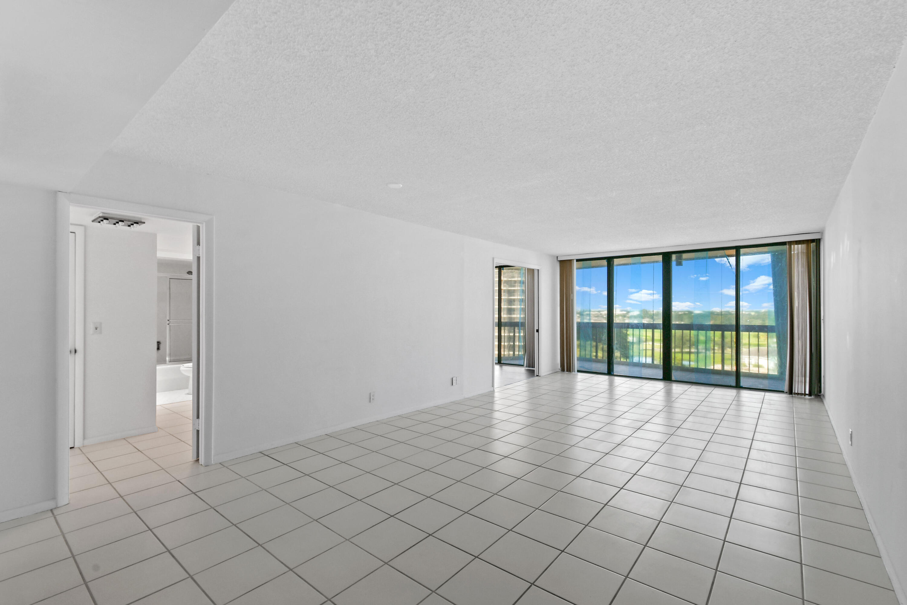 2425 Presidential Way, Unit 801 West Palm Beach, FL 33401 - Photo 6 of 41 a view of an empty room and window