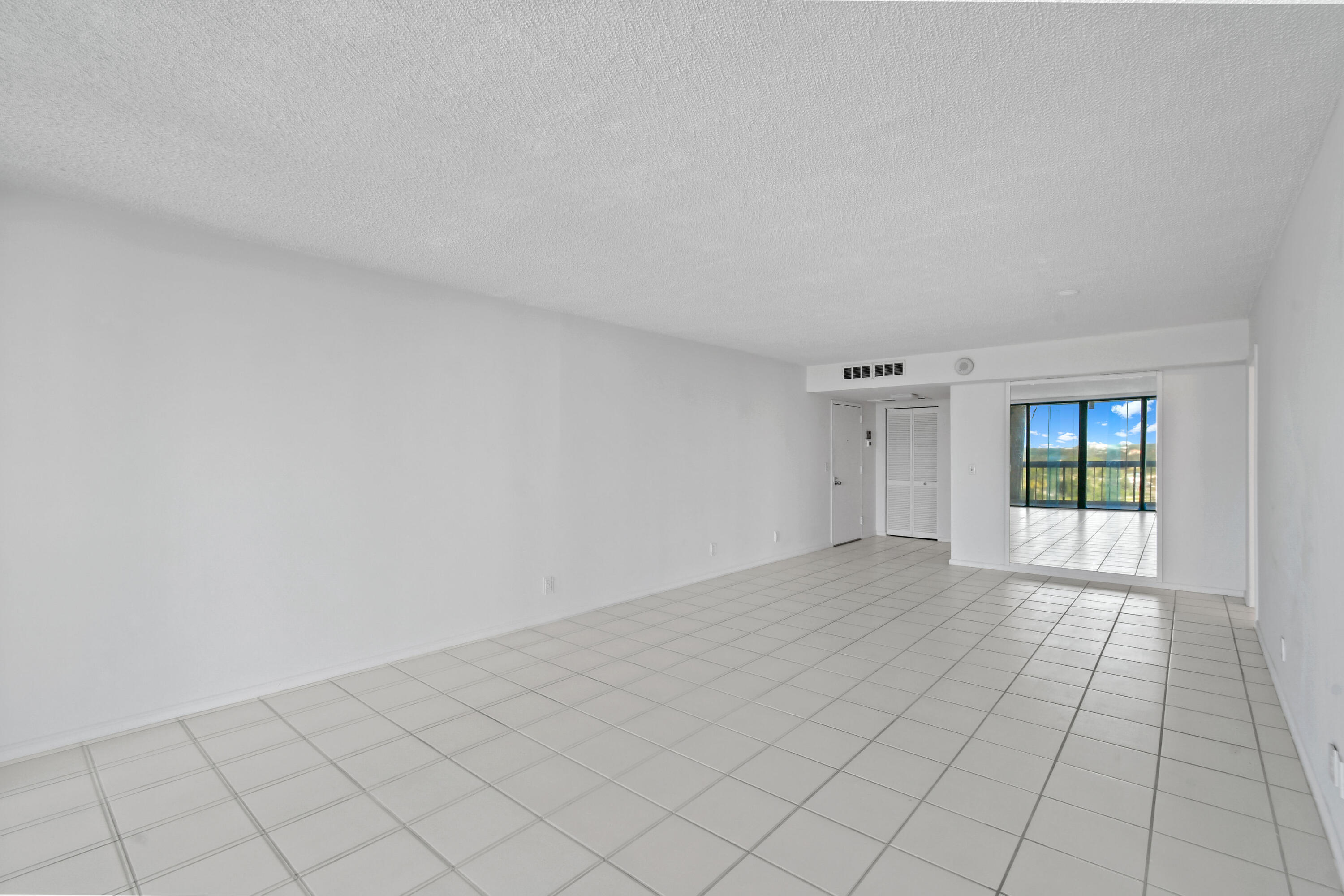 2425 Presidential Way, Unit 801 West Palm Beach, FL 33401 - Photo 8 of 41 a view of an empty room and window
