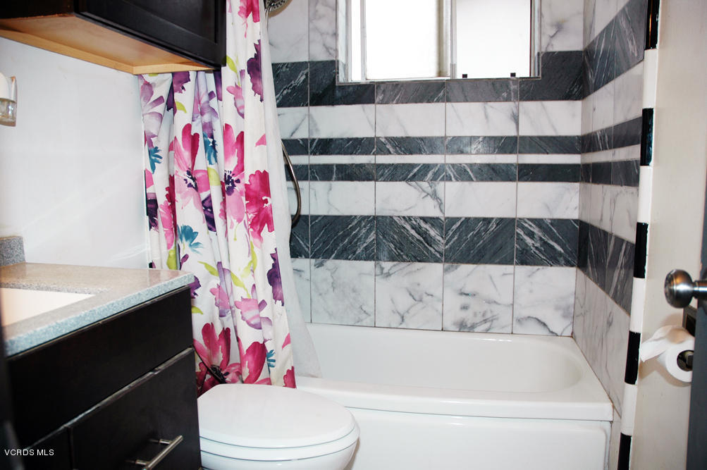2218 Ralston Street Simi Valley, CA 93063 - Photo 11 of 23 a bathroom with a bathtub and shower