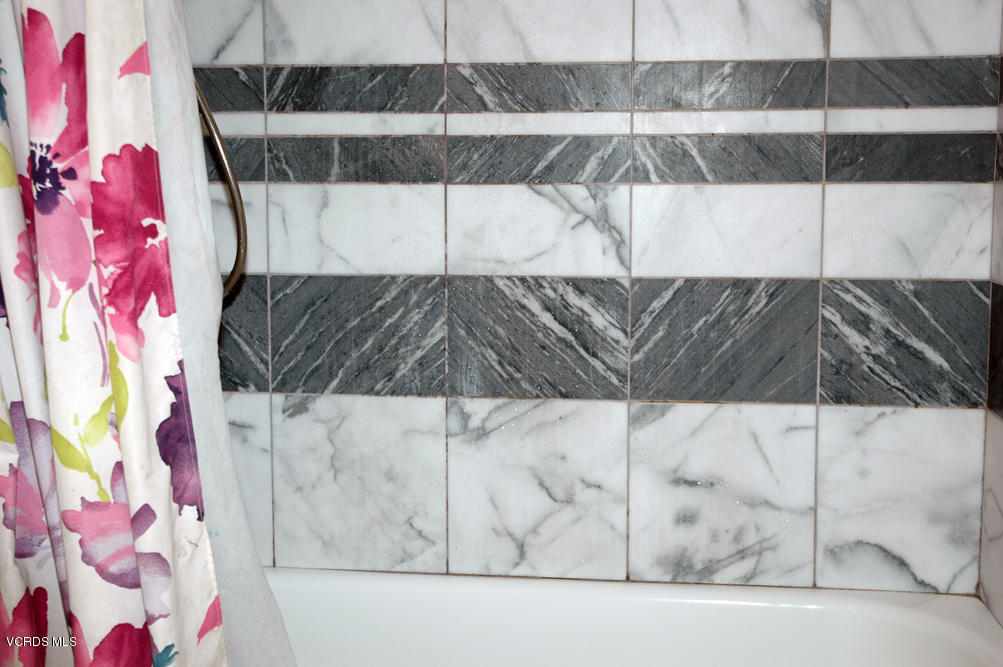 2218 Ralston Street Simi Valley, CA 93063 - Photo 12 of 23 a white cabinet with a black and white comforter