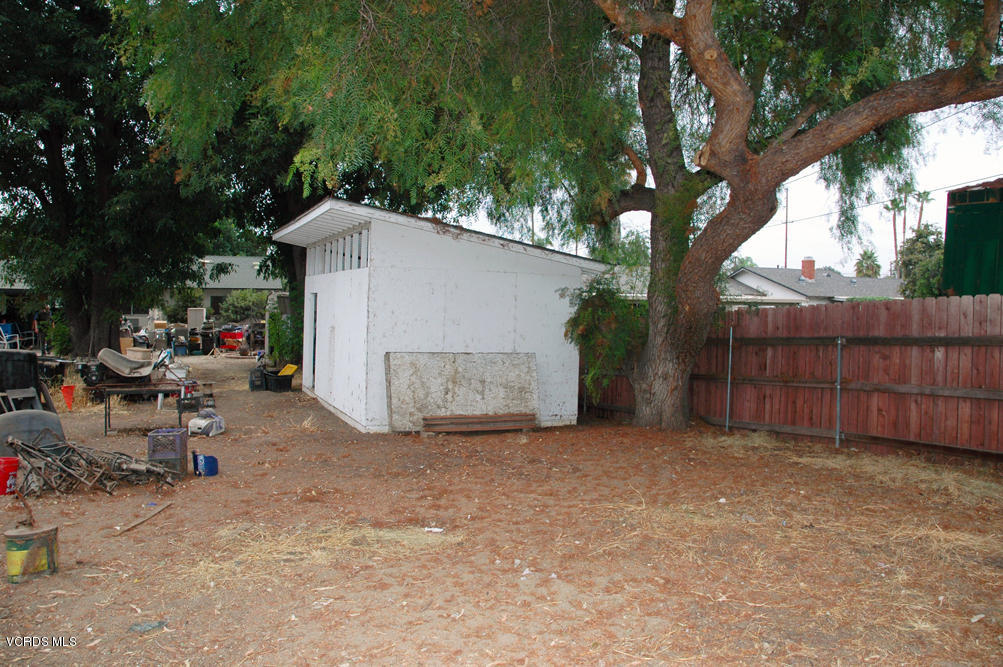 2218 Ralston Street Simi Valley, CA 93063 - Photo 19 of 23 a view of a backyard with a small cabin and a chair