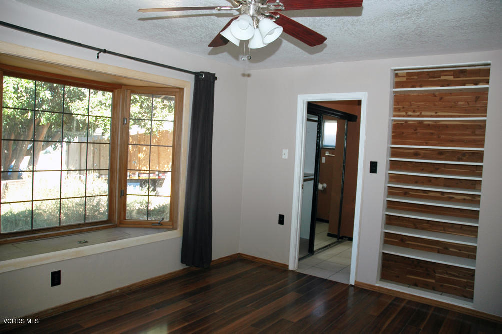 2218 Ralston Street Simi Valley, CA 93063 - Photo 7 of 23 a view of empty room with wooden floor and fan