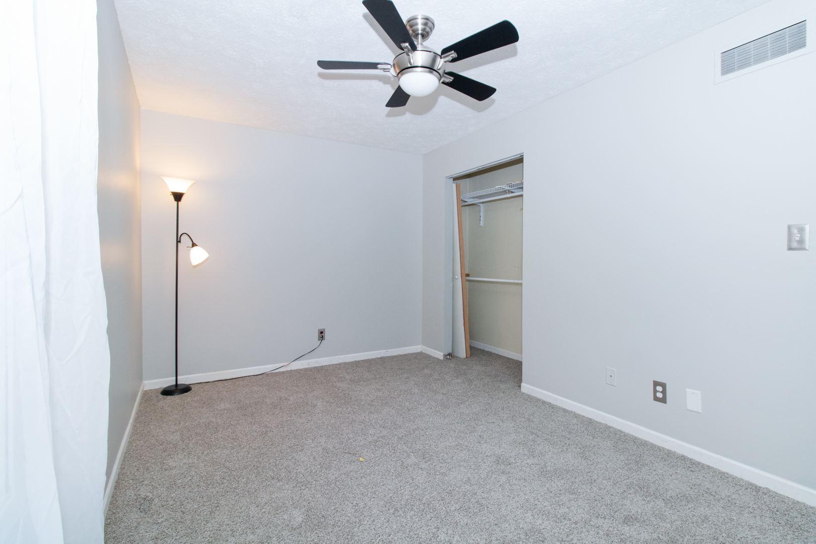 12 Timberview Drive Bloomington, IL 61701 - Photo 23 of 40 an empty room with closet and a ceiling fan