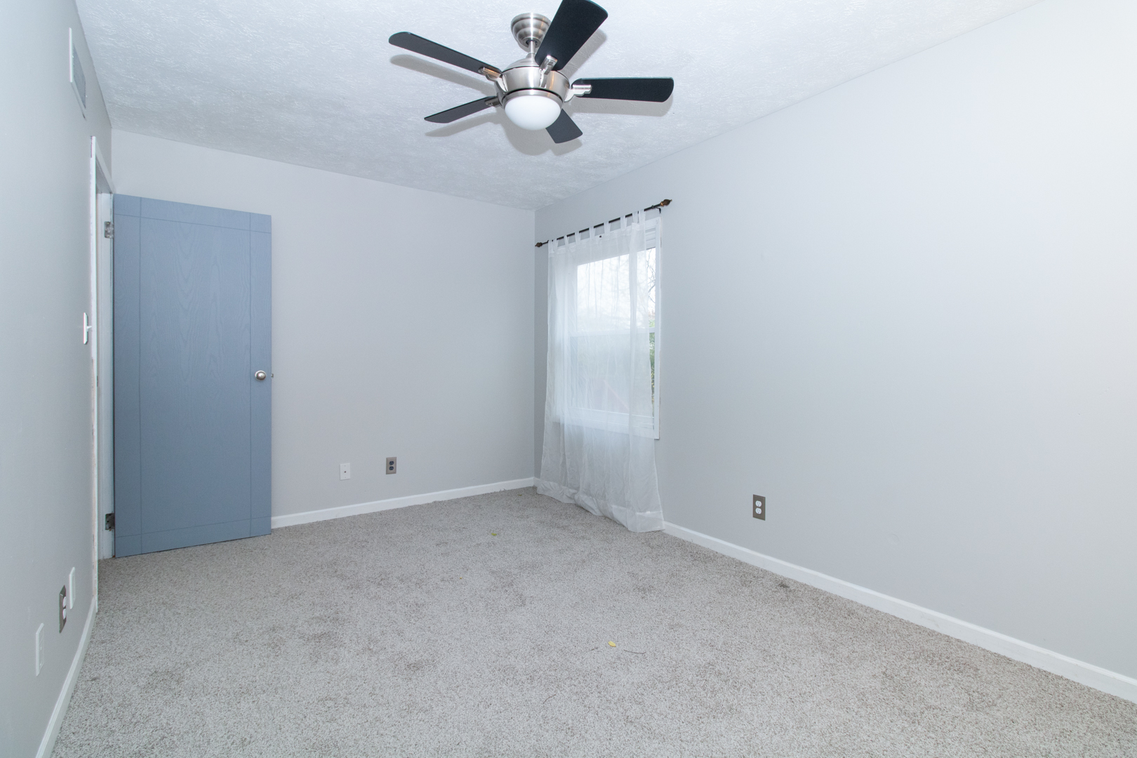 12 Timberview Drive Bloomington, IL 61701 - Photo 24 of 40 an empty room with a window and a fan