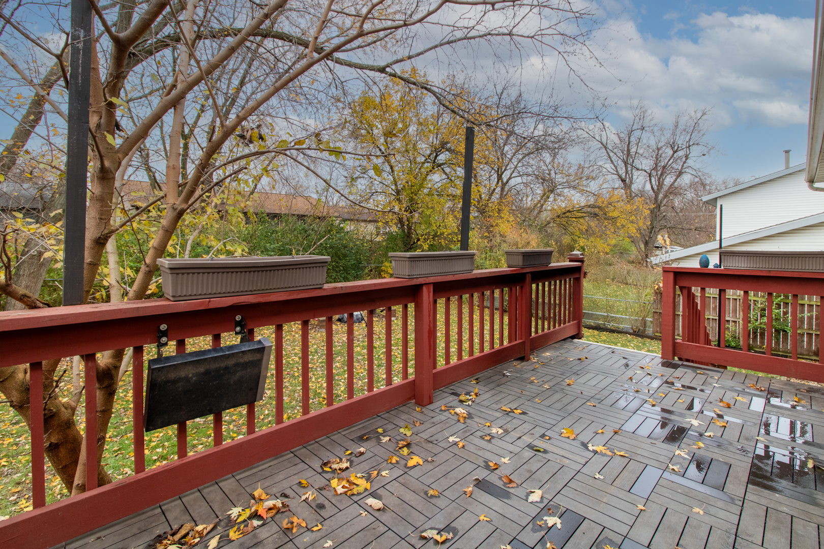 12 Timberview Drive Bloomington, IL 61701 - Photo 33 of 40 a balcony with wooden floor and trees