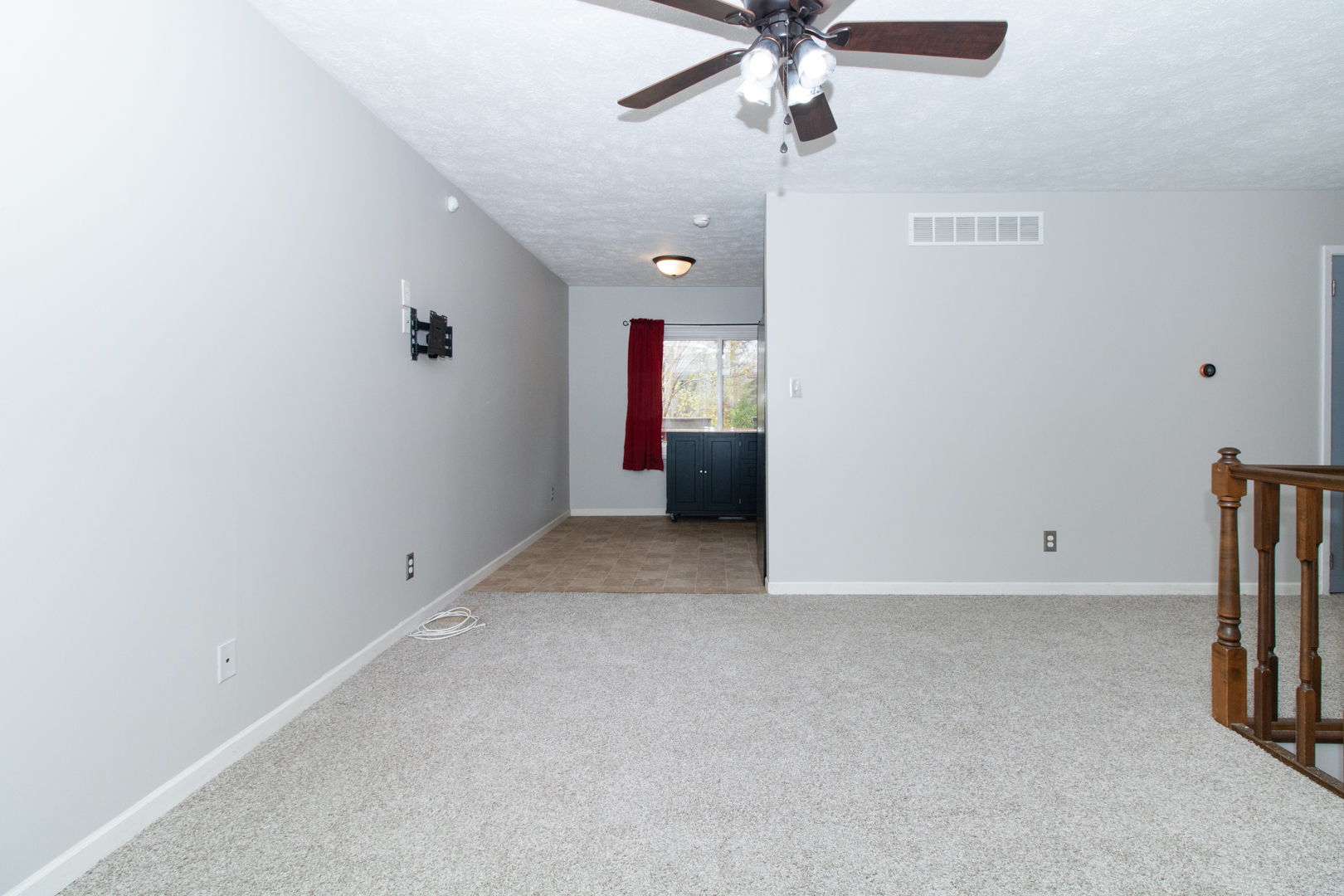 12 Timberview Drive Bloomington, IL 61701 - Photo 5 of 40 an empty room with a ceiling fan and carpet