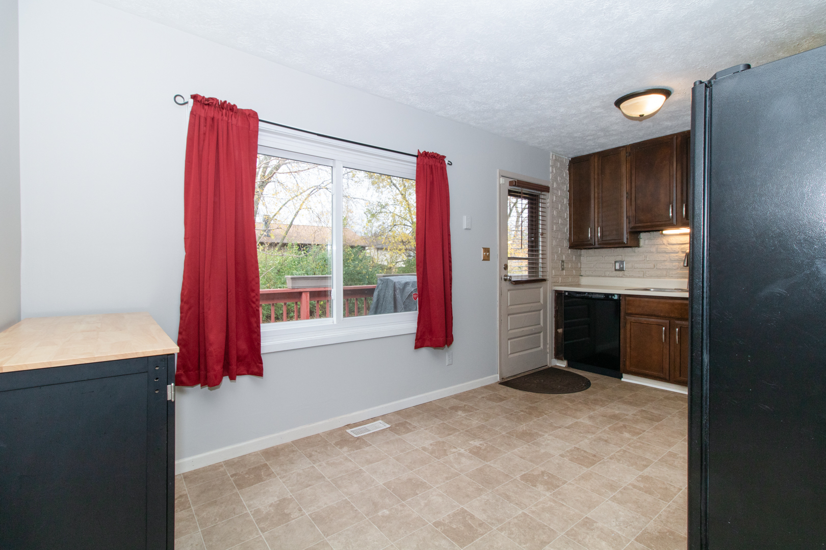 12 Timberview Drive Bloomington, IL 61701 - Photo 7 of 40 a kitchen with a refrigerator and window