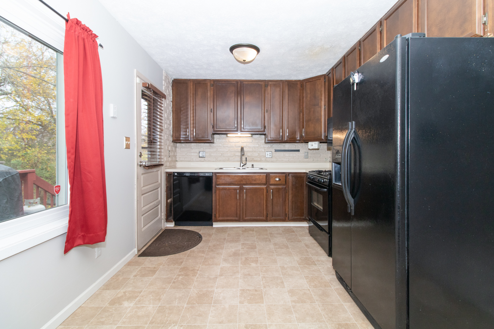 12 Timberview Drive Bloomington, IL 61701 - Photo 8 of 40 a kitchen with stainless steel appliances a sink stove and refrigerator