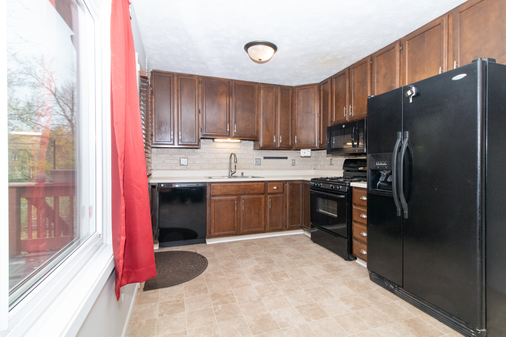 12 Timberview Drive Bloomington, IL 61701 - Photo 9 of 40 a kitchen with stainless steel appliances a refrigerator and a sink