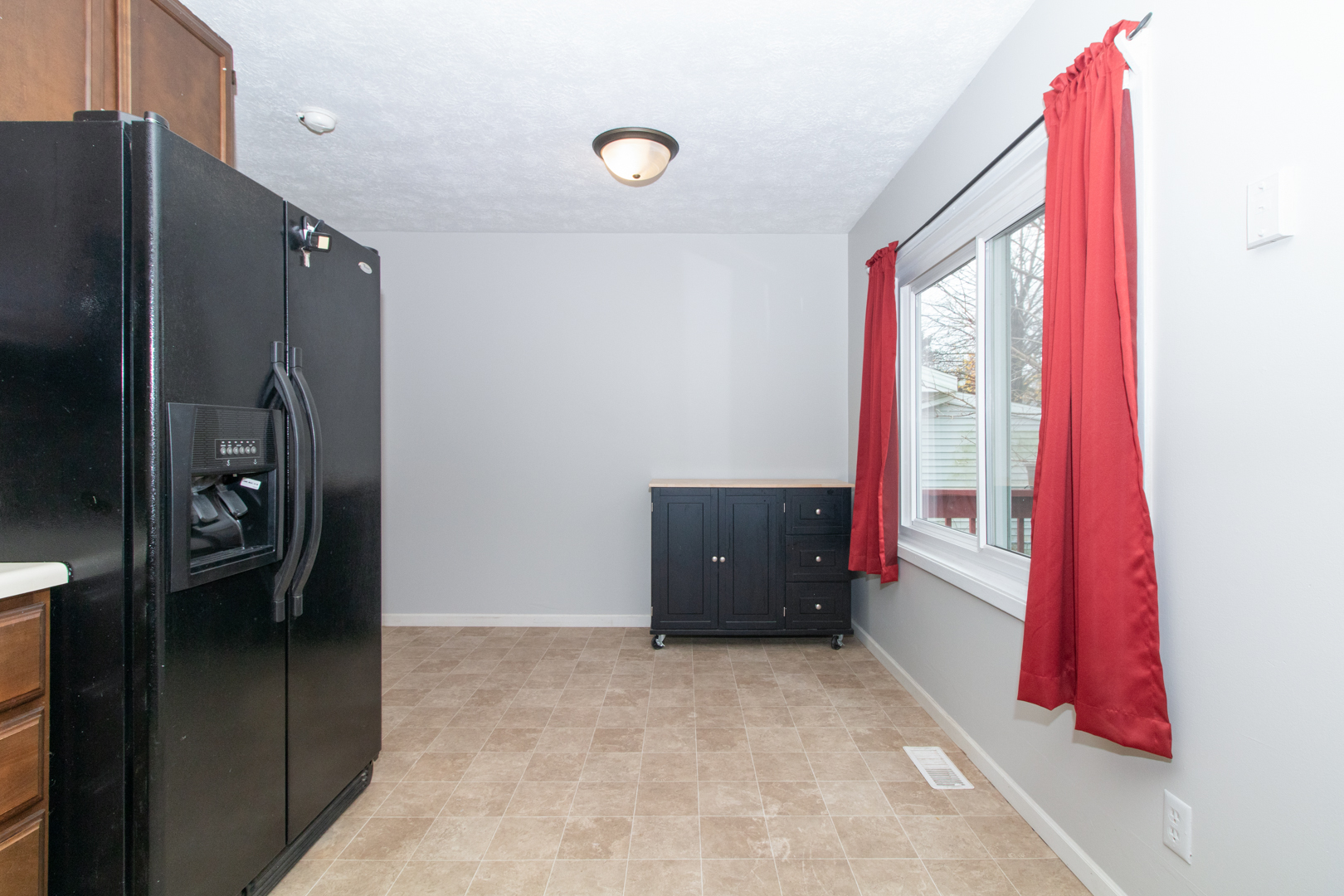 12 Timberview Drive Bloomington, IL 61701 - Photo 10 of 40 a view of a bedroom with window and refrigerator