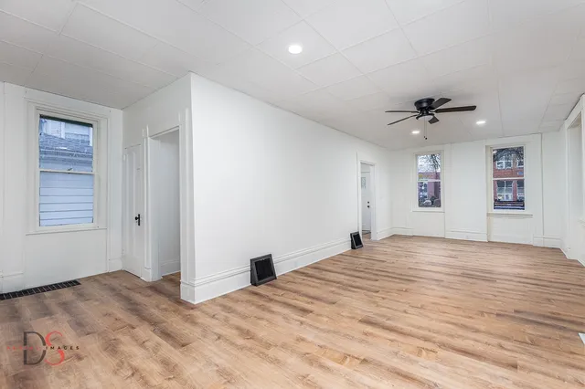 a view of an empty room with a window