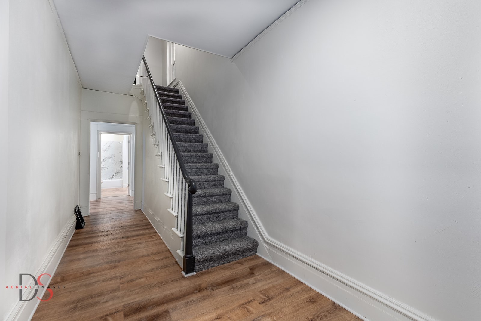 1009 Paul Street Ottawa, IL 61350 - Photo 8 of 18 a view of a hallway with wooden floor and entryway