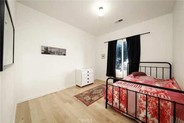 a bathroom with a double vanity sink mirror and shower