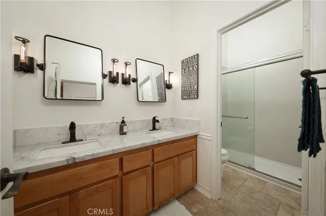 a bathroom with a shower and toilet