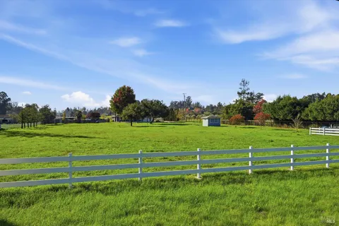 a view of a golf course with a garden