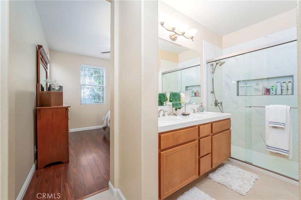 97 Chadron Circle Ladera Ranch, CA 92694 - Photo 23 of 56 Primary en-suite bath with dual sinks and a newer walk-in shower as well as a separate water closet
