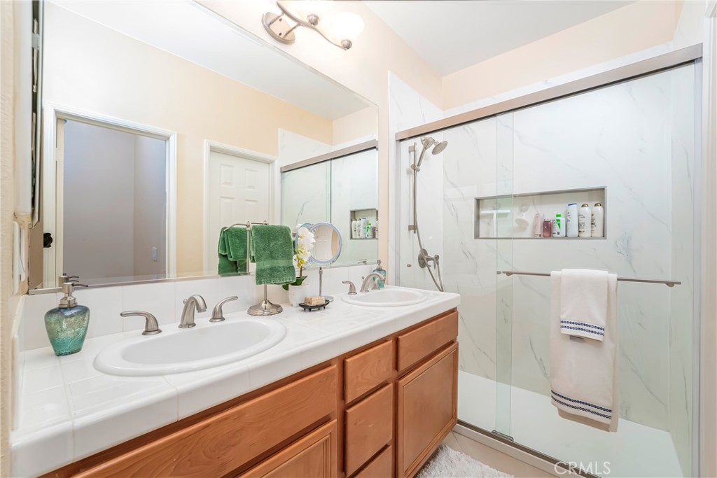 97 Chadron Circle Ladera Ranch, CA 92694 - Photo 25 of 56 Primary en-suite bath with dual sinks and a newer walk-in shower as well as a separate water closet