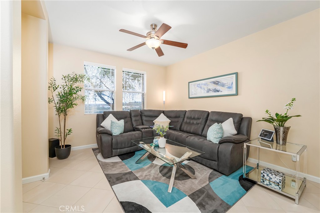 97 Chadron Circle Ladera Ranch, CA 92694 - Photo 7 of 56 Inviting great room with high ceiling, gas fireplace, ceiling fan, Southwest facing windows for natural light and beautiful open view