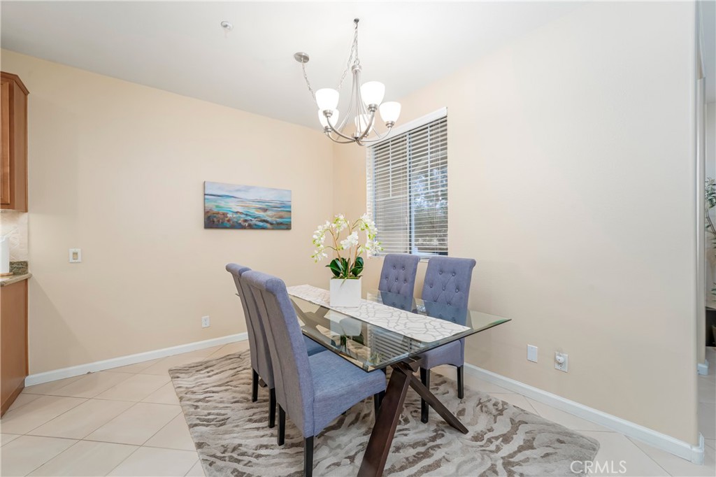 97 Chadron Circle Ladera Ranch, CA 92694 - Photo 9 of 56 Large dining room open to the island kitchen with breakfast bar and to the living room as well with Southwest facing windows with open views