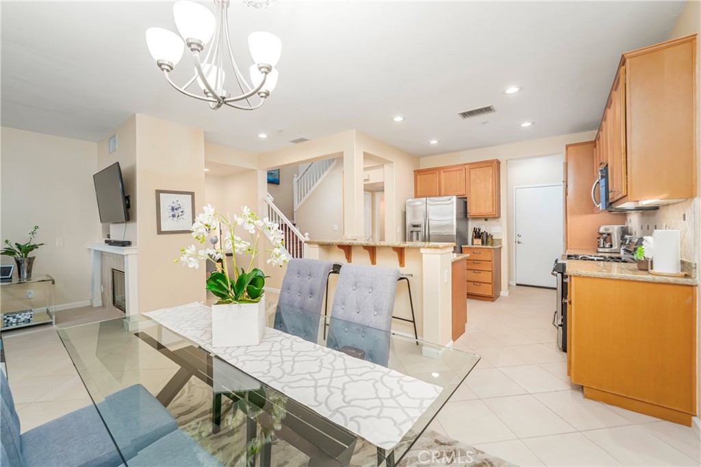 97 Chadron Circle Ladera Ranch, CA 92694 - Photo 10 of 56 Large dining room open to the island kitchen with breakfast bar and to the living room as well with Southwest facing windows with open views
