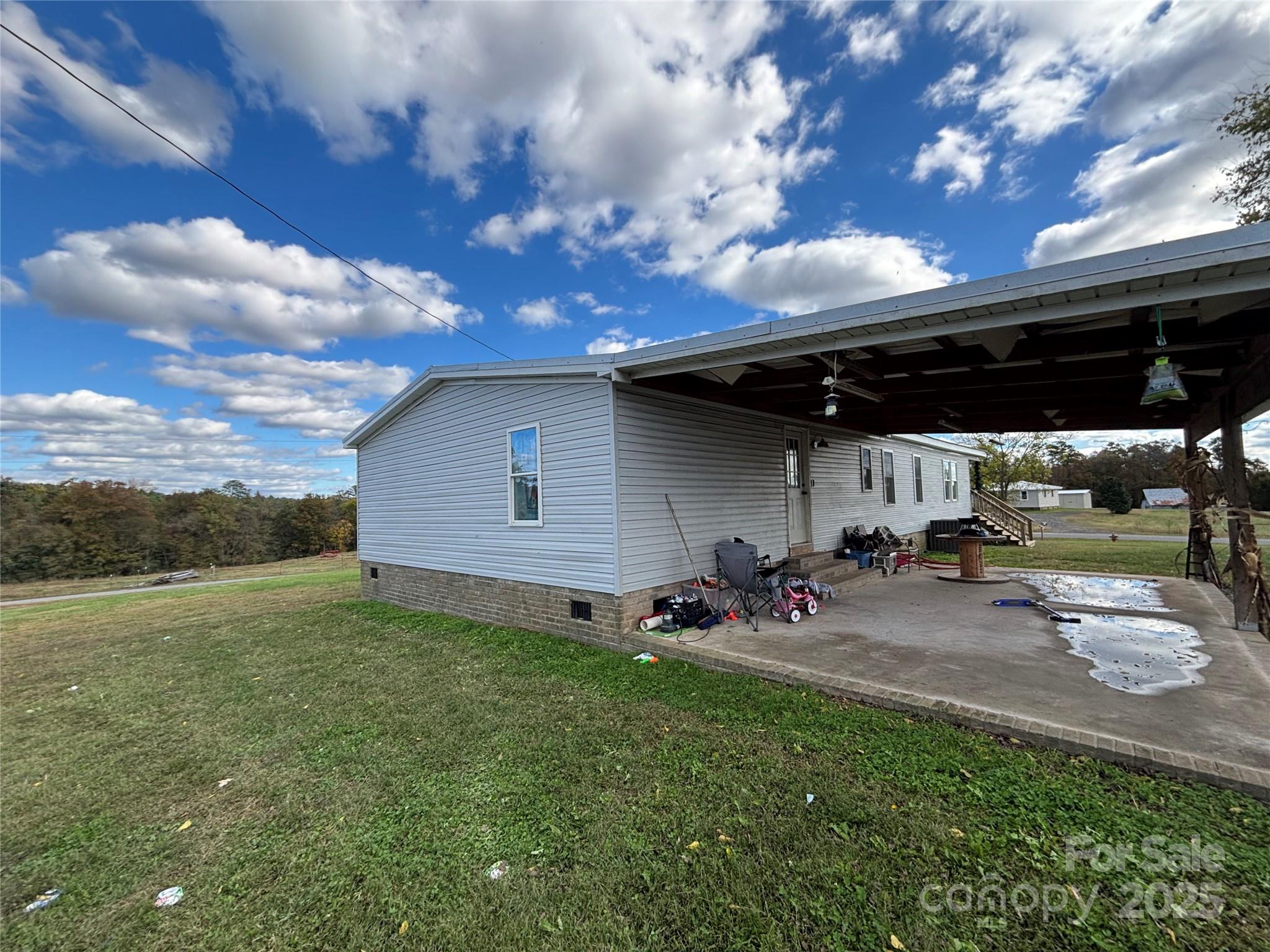 1126 Bunn Road Polkton, NC 28135 - Photo 3 of 14 a view of a backyard with sitting area