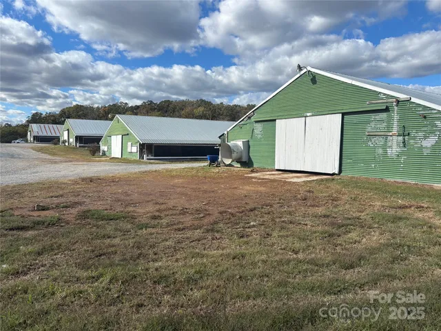 a view of a house with a yard and garage