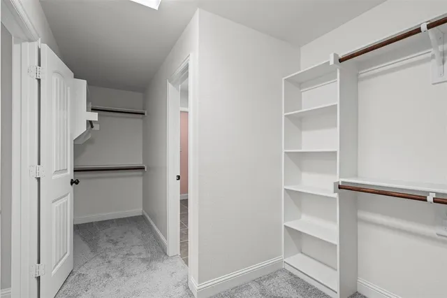 a view of an empty walk in closet