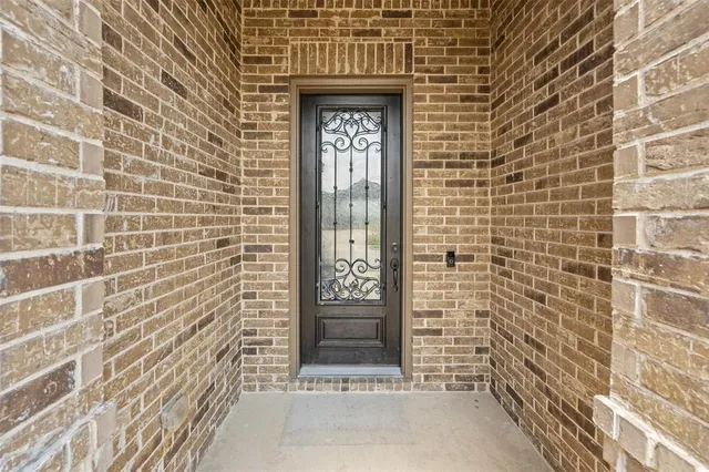 a view of a door and a window