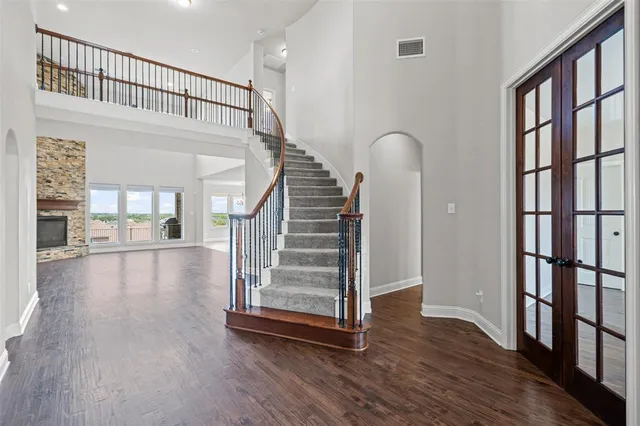 a view of staircase with white walls and windows