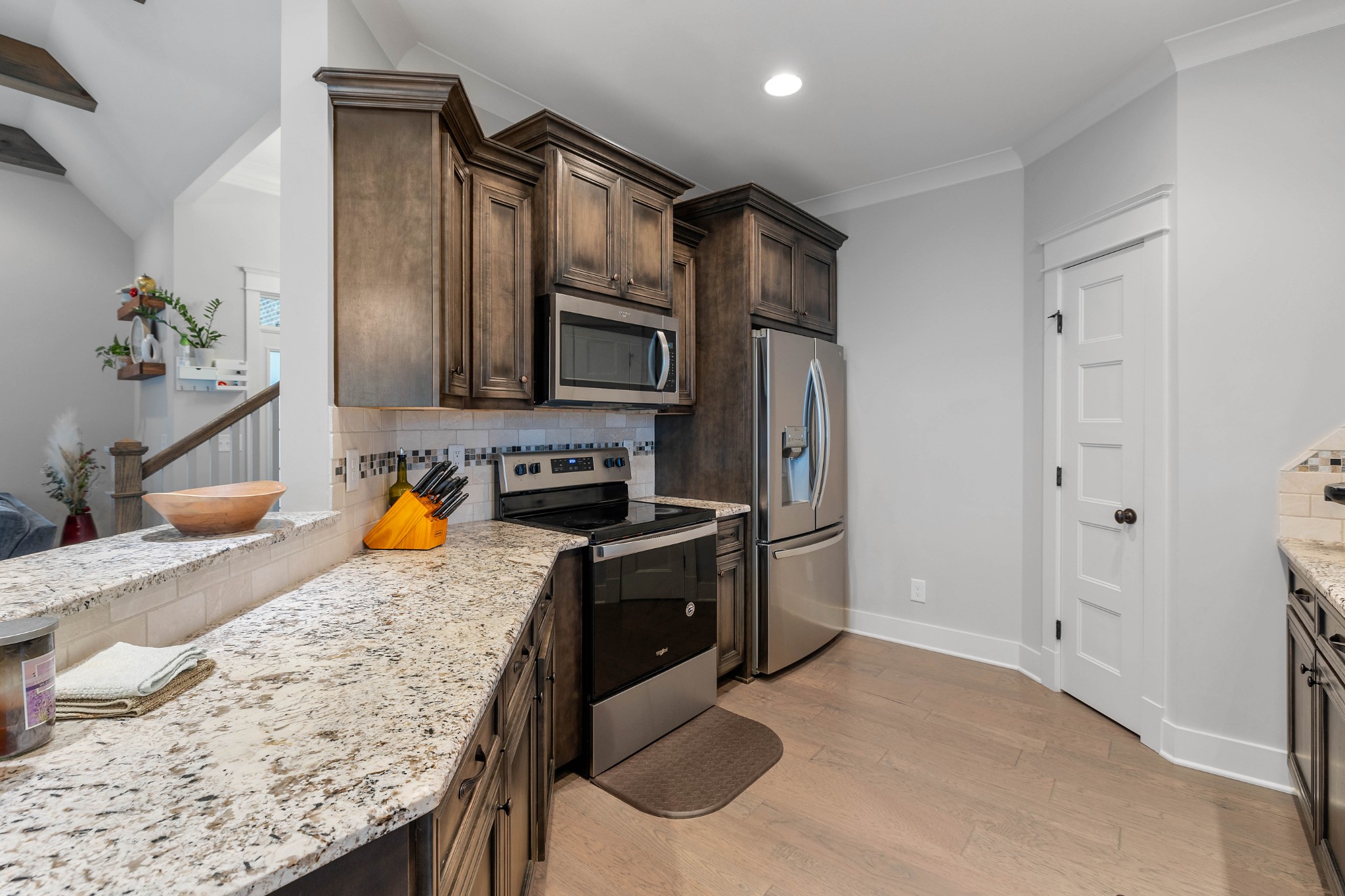 136 Neecee Drive Smyrna, TN 37167 - Photo 11 of 35 a kitchen with stainless steel appliances granite countertop a sink stove and refrigerator