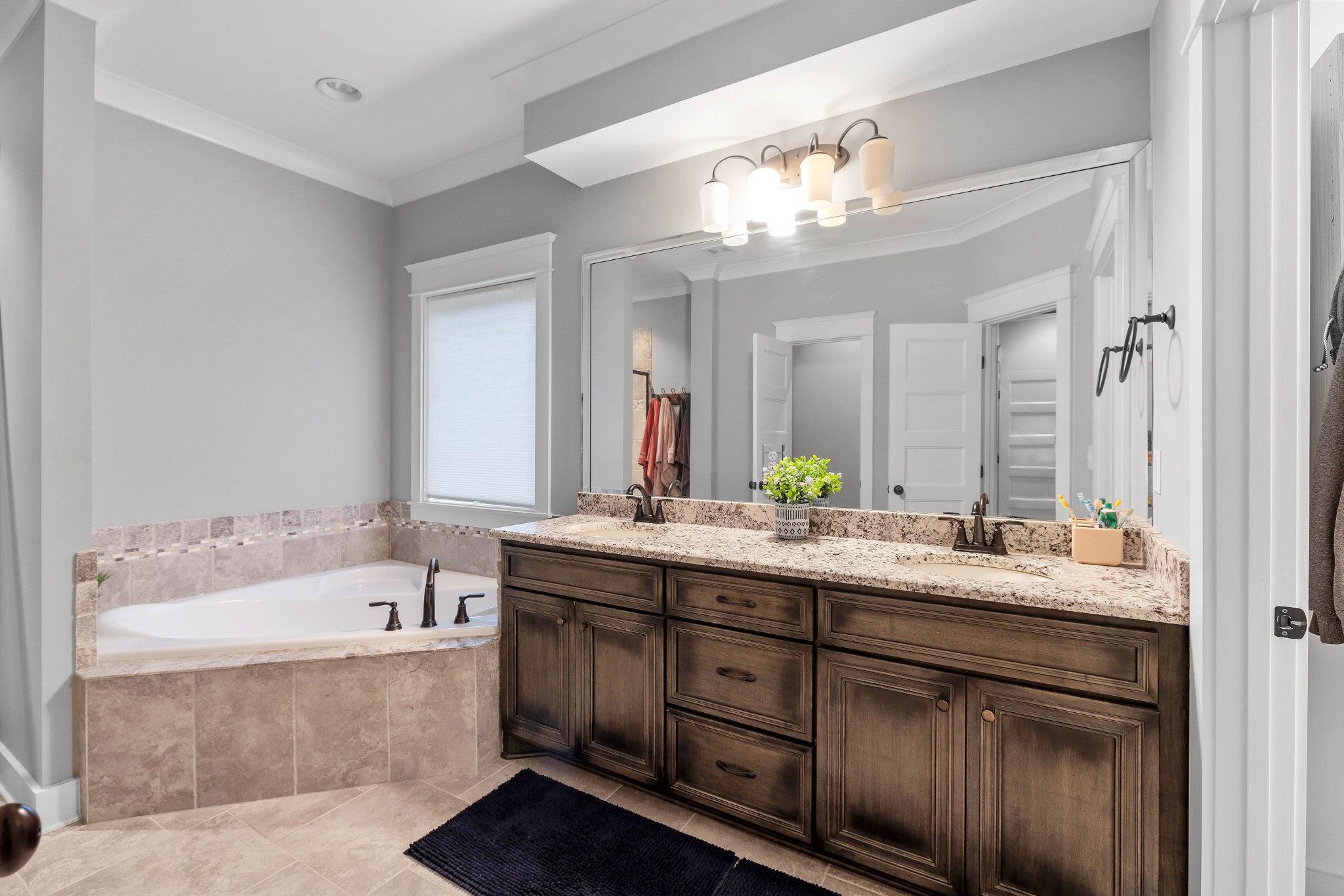 136 Neecee Drive Smyrna, TN 37167 - Photo 19 of 35 a bathroom with a tub double sink and mirror