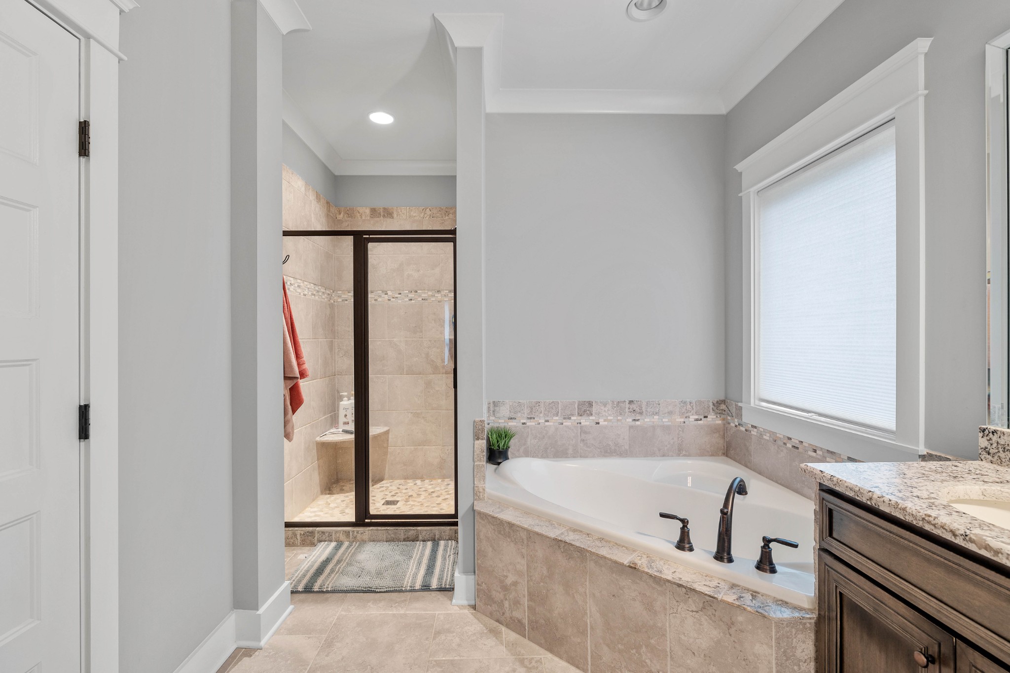 136 Neecee Drive Smyrna, TN 37167 - Photo 20 of 35 a bathroom with a tub a mirror and a shower