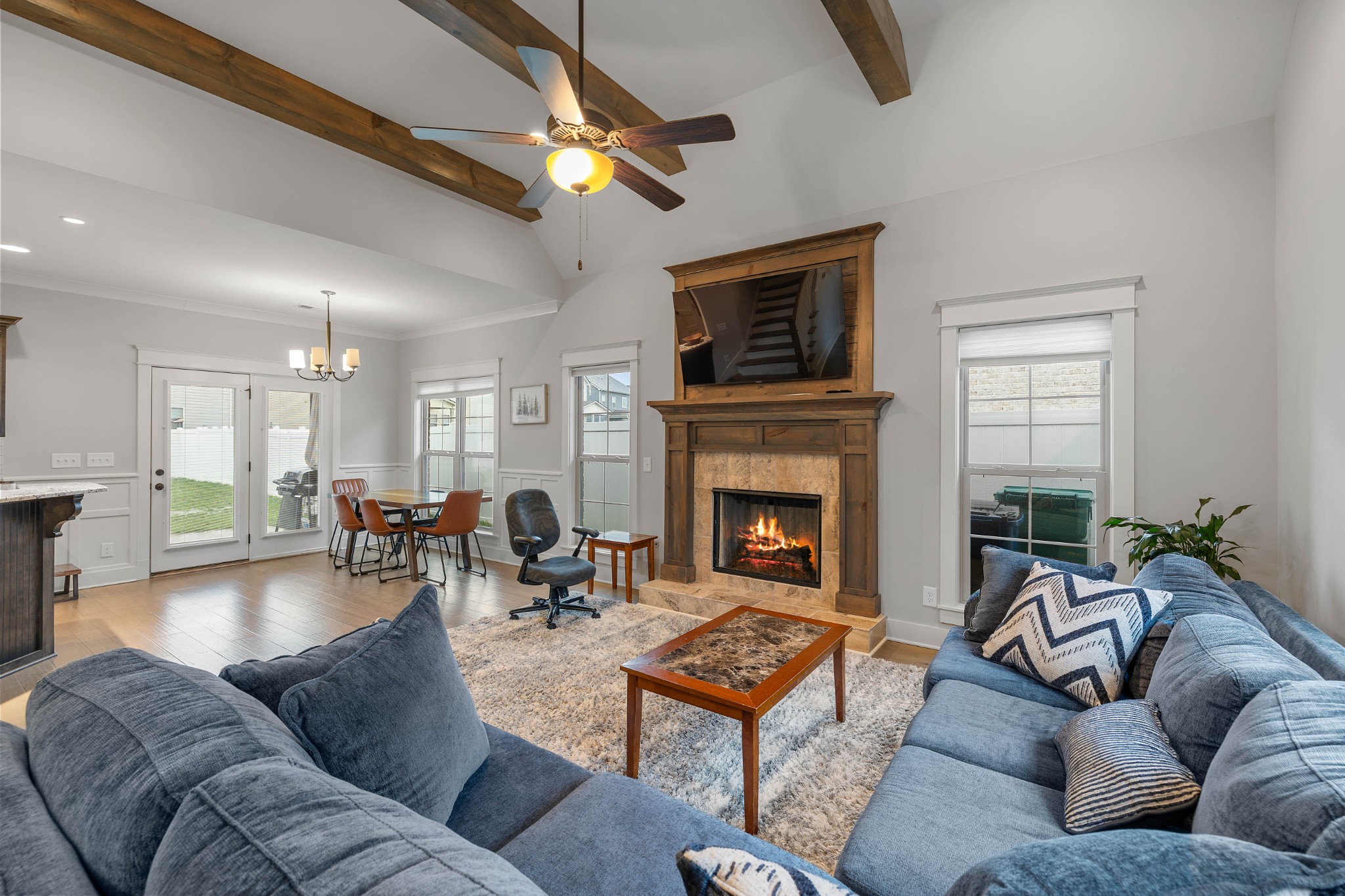 136 Neecee Drive Smyrna, TN 37167 - Photo 5 of 35 a living room with furniture a flat screen tv and a fireplace