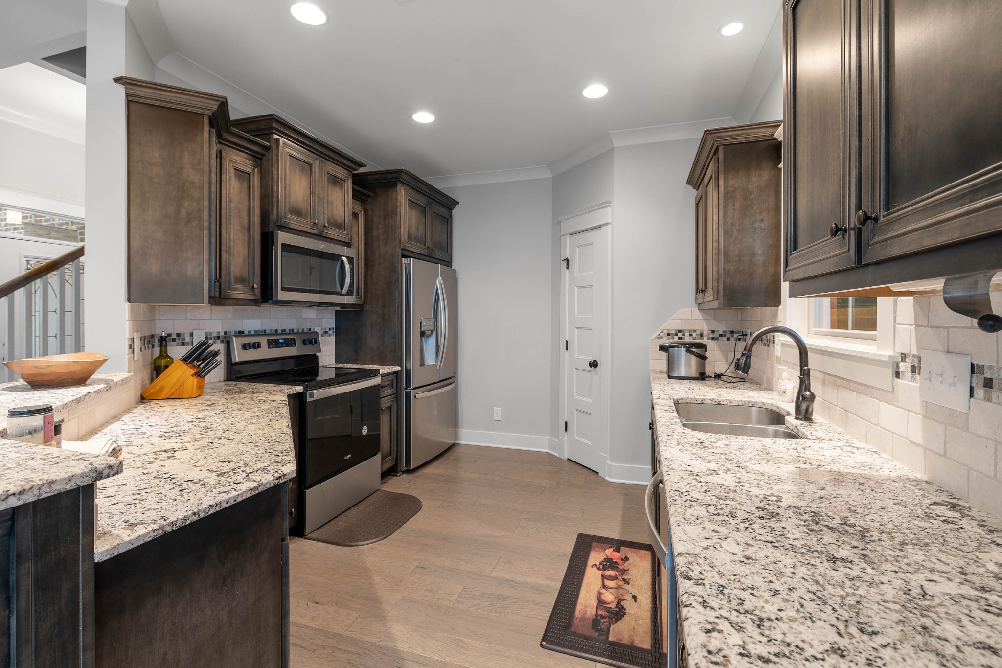 136 Neecee Drive Smyrna, TN 37167 - Photo 9 of 35 a kitchen with stainless steel appliances granite countertop a sink stove and refrigerator