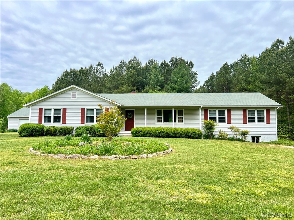 1660 Wills Road Ford, VA 23850 - Photo 1 of 36 a front view of a house with a yard and green space