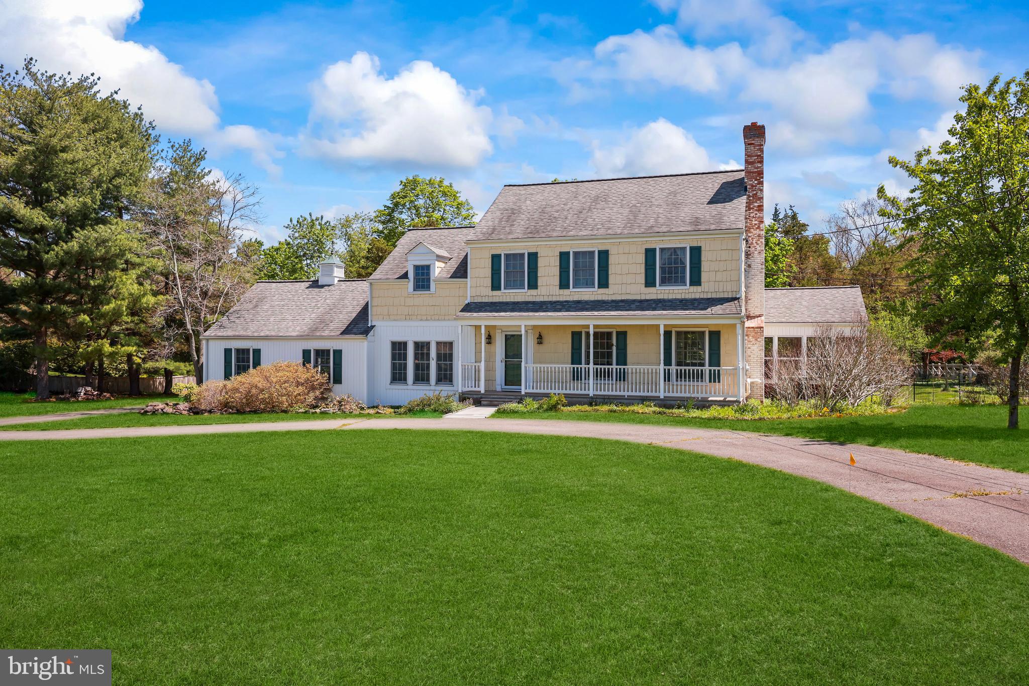 339 Mountain View Road Skillman, NJ 08558 - Photo 2 of 54 a front view of a house with a garden