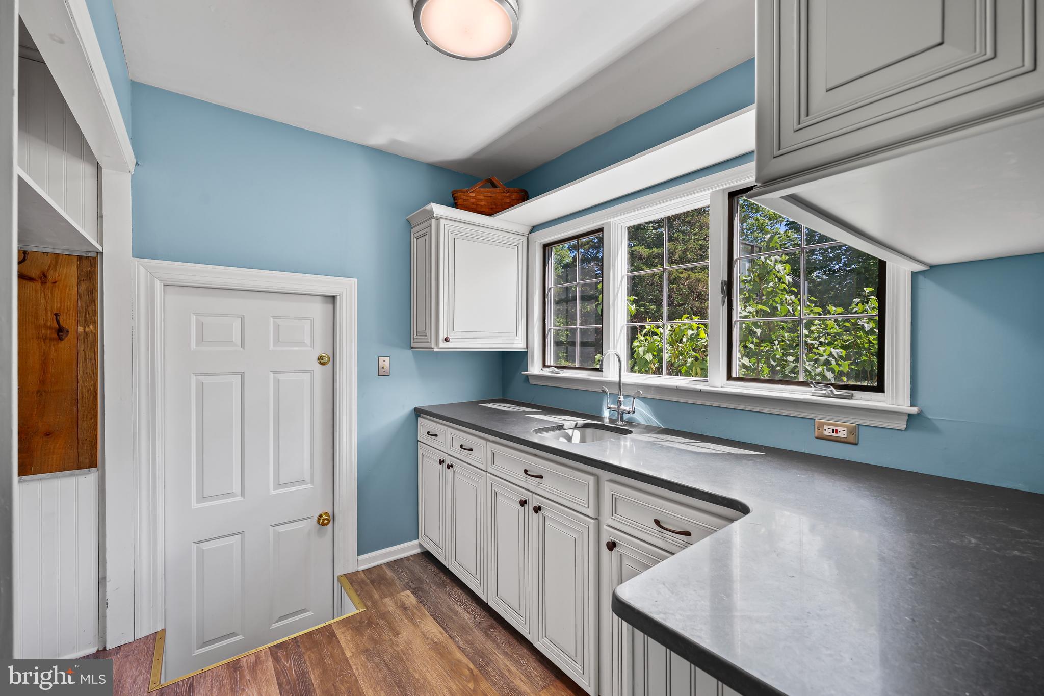 339 Mountain View Road Skillman, NJ 08558 - Photo 21 of 54 a kitchen with a sink window and cabinets