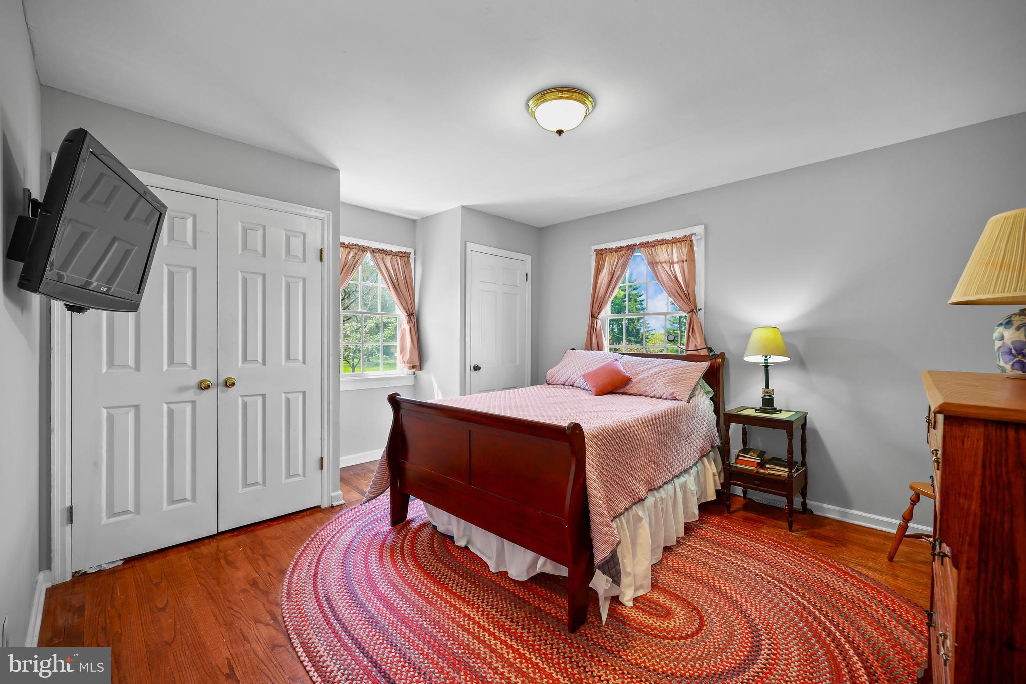 339 Mountain View Road Skillman, NJ 08558 - Photo 32 of 54 a bedroom with a bed and wooden floor