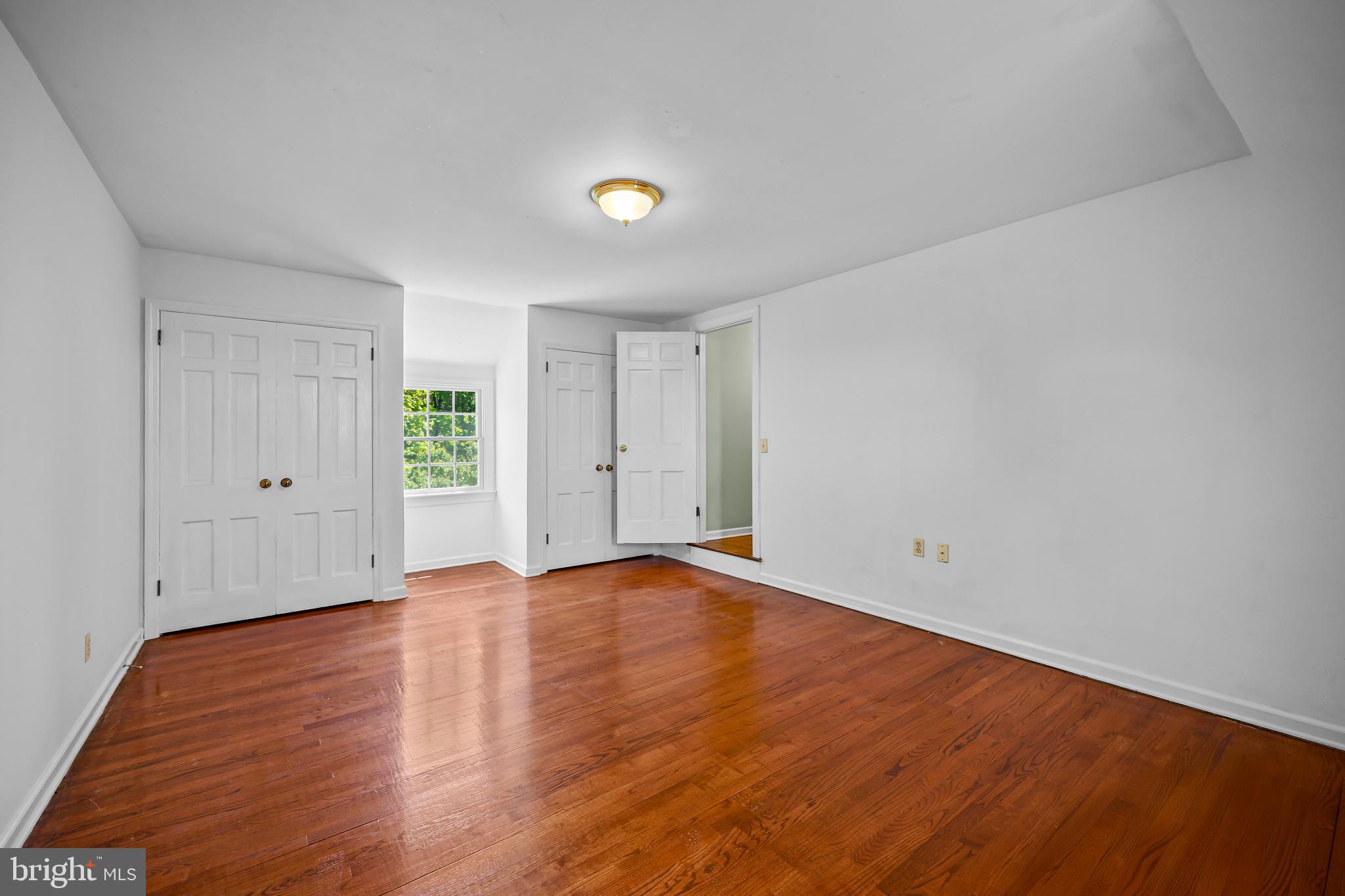 339 Mountain View Road Skillman, NJ 08558 - Photo 35 of 54 a view of an empty room with wooden floor