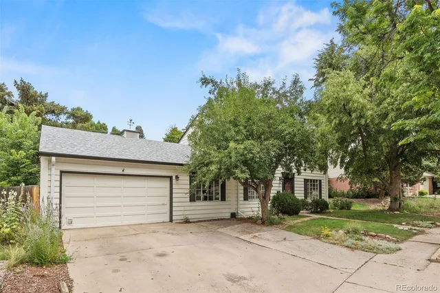 a house with trees in the background