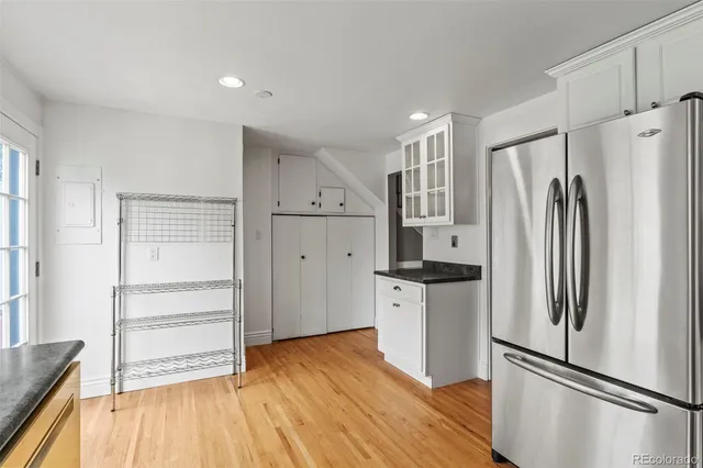 a kitchen with stainless steel appliances a refrigerator and a stove top oven