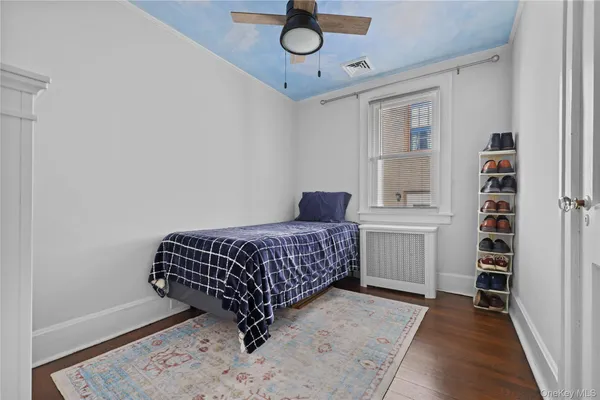 a bedroom with a bed and closet